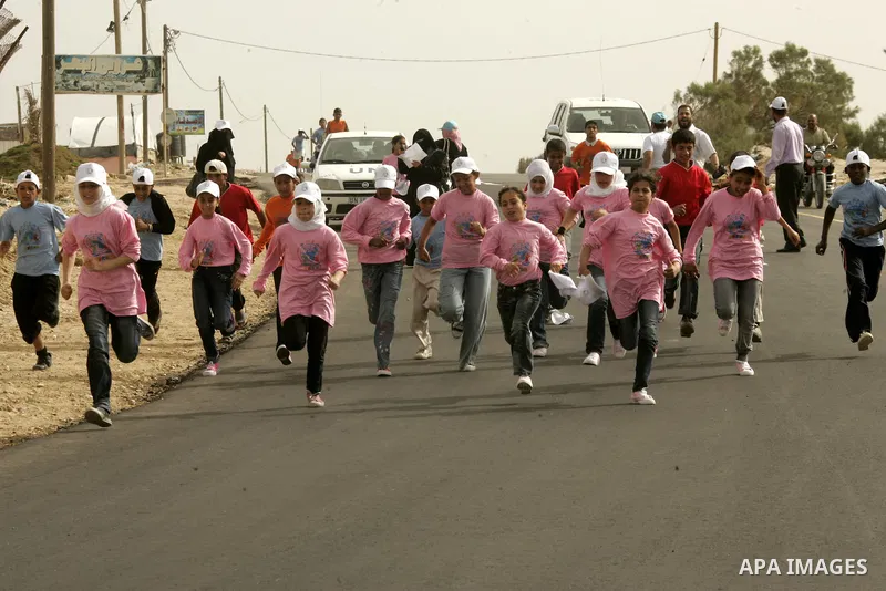 Palestinian and foreign participants run in Rafah town in the southern Gaza Strip on May 5, 2011 as they compete in the Gaza Strip's first-ever marathon which runs the entire length of the coastal enclave. Photo by Abed...