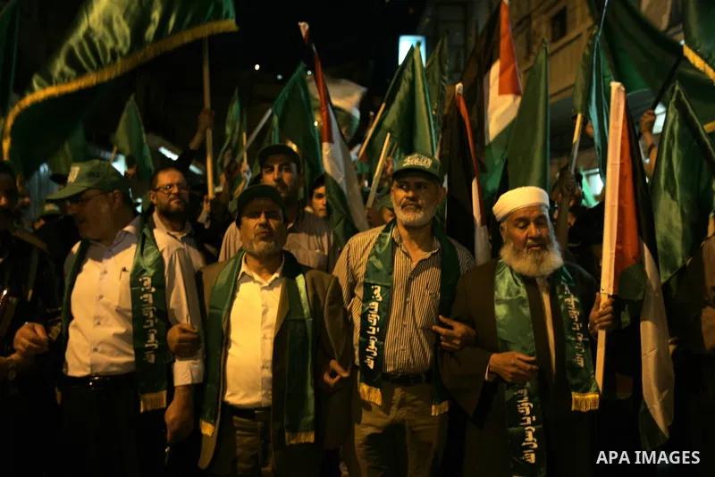 Palestinian Hamas supporters rally in the streets of the West Bank city of Nablus to celebrate on May 5, 2011 the political unity reconciliation deal between the Islamic group and the Fatah movement which was signed by t...