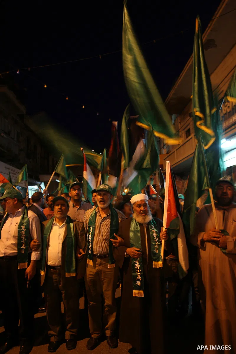 Palestinian Hamas supporters rally in the streets of the West Bank city of Nablus to celebrate on May 5, 2011 the political unity reconciliation deal between the Islamic group and the Fatah movement which was signed by t...