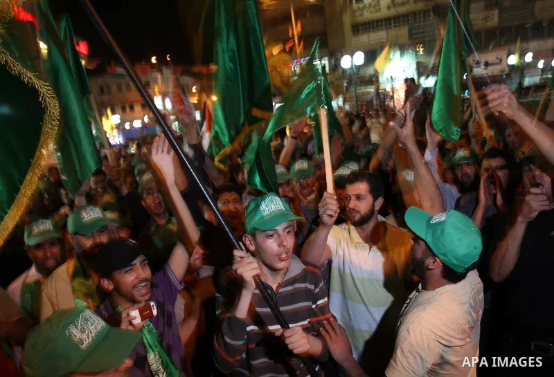 Palestinian Hamas supporters rally in the streets of the West Bank city of Nablus to celebrate on May 5, 2011 the political unity reconciliation deal between the Islamic group and the Fatah movement which was signed by t...