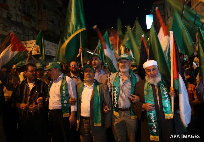 Palestinian Hamas supporters rally in the streets of the West Bank city of Nablus to celebrate on May 5, 2011 the political unity reconciliation deal between the Islamic group and the Fatah movement which was signed by t...