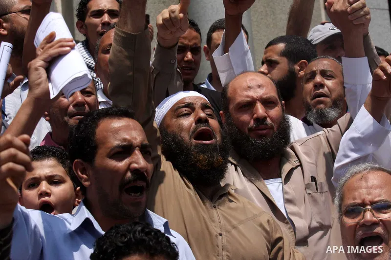 Egyptian Islamists shout slogans during a march to the US embassy after the weekly Friday prayer in Cairo on May 6, 2011, during a demonstration to denounce the killing of Osama bin Laden by US forces in Pakistan. Photo...