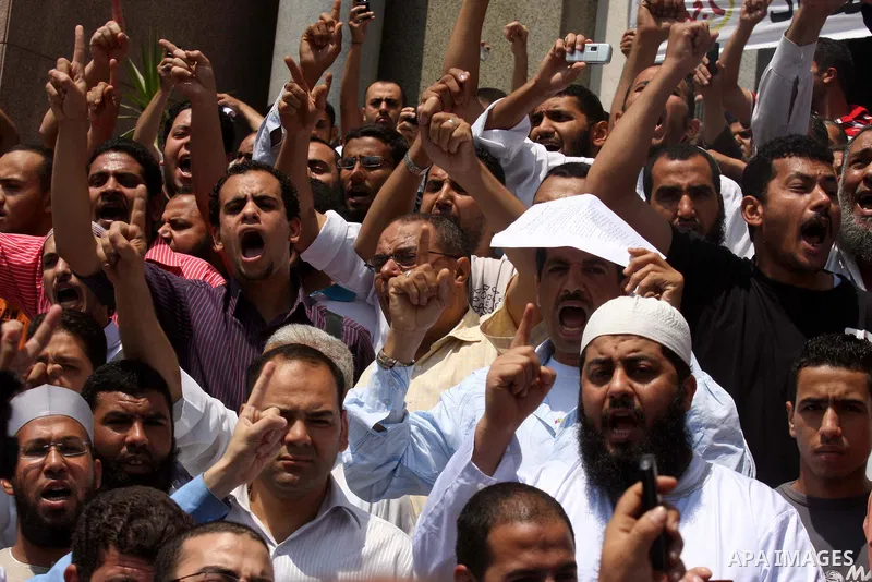 Egyptian Islamists shout slogans during a march to the US embassy after the weekly Friday prayer in Cairo on May 6, 2011, during a demonstration to denounce the killing of Osama bin Laden by US forces in Pakistan. Photo...