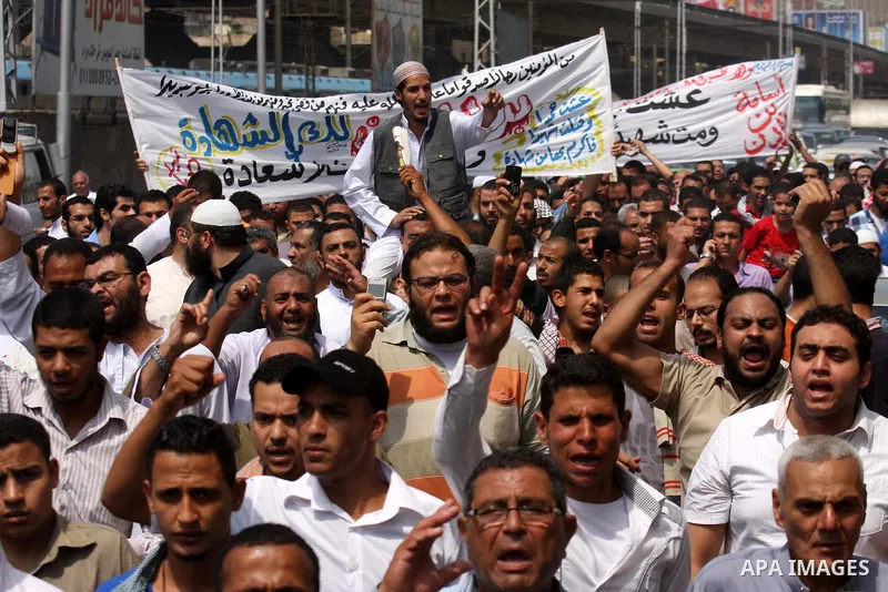 Egyptian Islamists shout slogans during a march to the US embassy after the weekly Friday prayer in Cairo on May 6, 2011, during a demonstration to denounce the killing of Osama bin Laden by US forces in Pakistan. Photo...