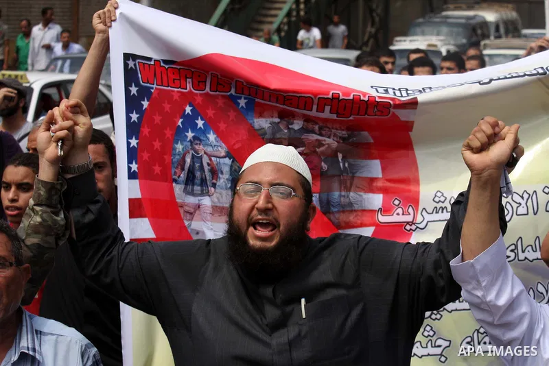 Egyptian Islamists shout slogans during a march to the US embassy after the weekly Friday prayer in Cairo on May 6, 2011, during a demonstration to denounce the killing of Osama bin Laden by US forces in Pakistan. Photo...
