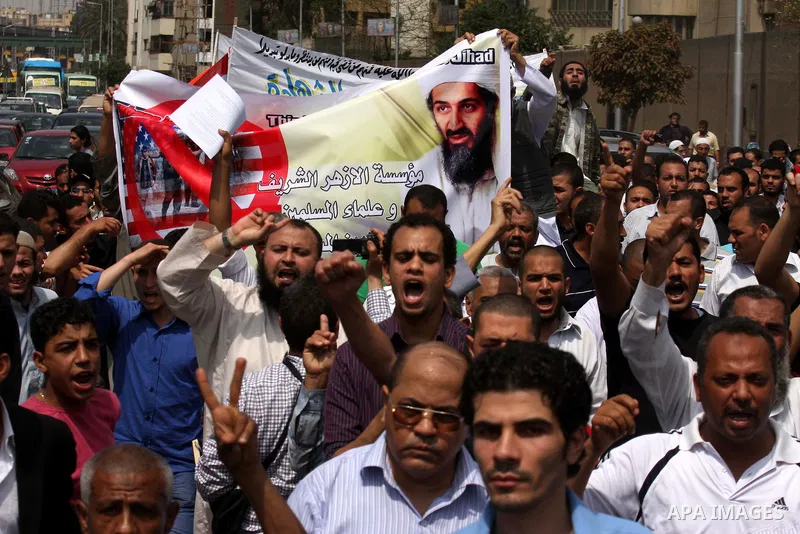 Egyptian Islamists, carrying a picture of late Al-Qaeda chief Osama bin Laden, march to the US embassy after the weekly Friday prayer in Cairo on May 6, 2011, during a demonstration to denounce the killing of Osama bin L...