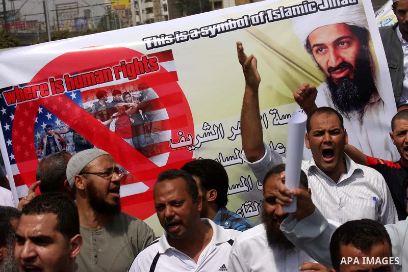 Egyptian Islamists, carrying a picture of late Al-Qaeda chief Osama bin Laden, march to the US embassy after the weekly Friday prayer in Cairo on May 6, 2011, during a demonstration to denounce the killing of Osama bin L...