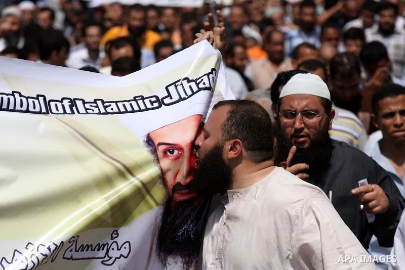 Egyptian Islamists, carrying a picture of late Al-Qaeda chief Osama bin Laden, march to the US embassy after the weekly Friday prayer in Cairo on May 6, 2011, during a demonstration to denounce the killing of Osama bin L...