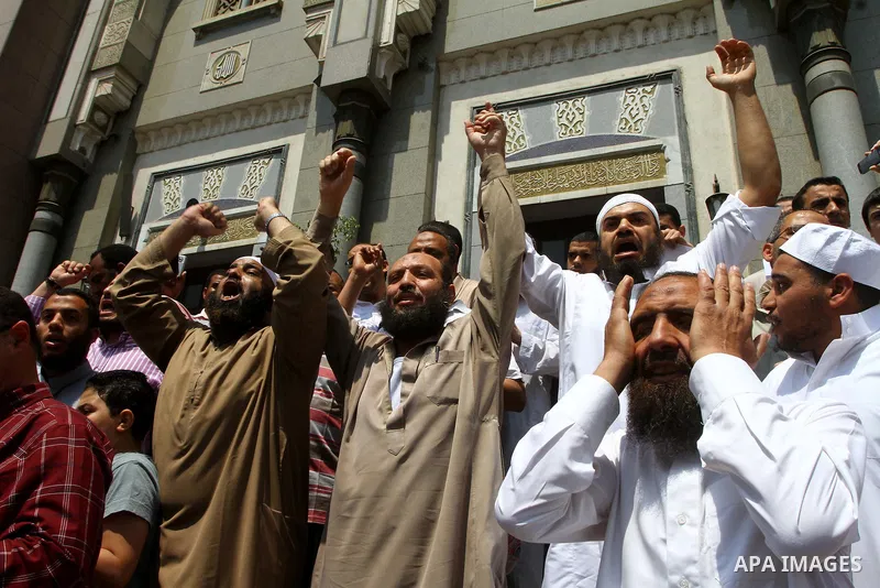 Egyptian Islamists shout slogans during a march to the US embassy after the weekly Friday prayer in Cairo on May 6, 2011, during a demonstration to denounce the killing of Osama bin Laden by US forces in Pakistan. Photo...