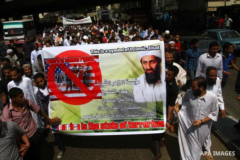 Egyptian Islamists, carrying a picture of late Al-Qaeda chief Osama bin Laden, march to the US embassy after the weekly Friday prayer in Cairo on May 6, 2011, during a demonstration to denounce the killing of Osama bin L...