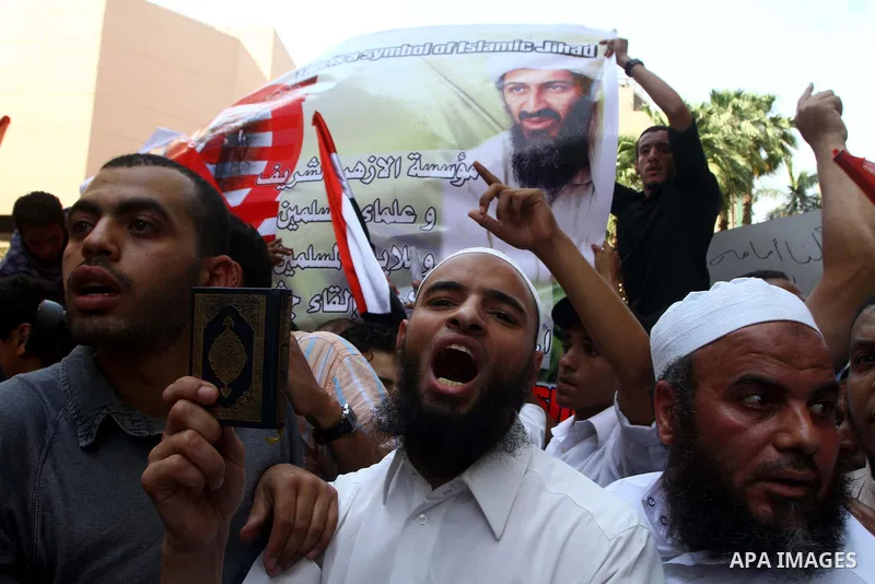 Egyptian Islamists, carrying a picture of late Al-Qaeda chief Osama bin Laden, march to the US embassy after the weekly Friday prayer in Cairo on May 6, 2011, during a demonstration to denounce the killing of Osama bin L...
