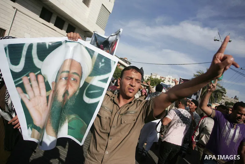 Palestinian Salafist groups, carrying pictures of late Al-Qaeda chief Osama bin Laden, march at Gaza central square, in Gaza city on May 7, 2011, during a demonstration to denounce the killing of bin Laden by US forces i...