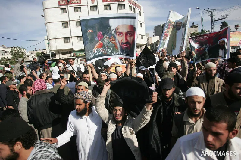 Palestinian Salafist groups, carrying pictures of late Al-Qaeda chief Osama bin Laden, march at Gaza central square, in Gaza city on May 7, 2011, during a demonstration to denounce the killing of bin Laden by US forces i...