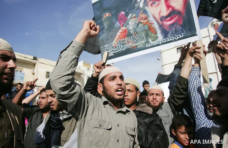 Palestinian Salafist groups, carrying pictures of late Al-Qaeda chief Osama bin Laden, march at Gaza central square, in Gaza city on May 7, 2011, during a demonstration to denounce the killing of bin Laden by US forces i...