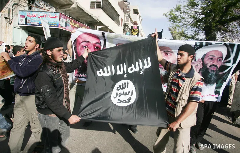 Palestinian Salafist groups hold Al Qaeda flag during a demonstration at Gaza central square, in Gaza city on May 7, 2011 to denounce the killing of late Al-Qaeda chief Osama bin Laden by US forces in Pakistan. Bin Laden...