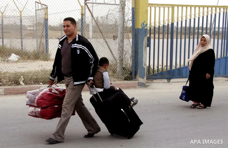 Palestinians arrive at their side of the Rafah border crossing with Egypt in the southern Gaza Strip on May 8, 2011. photo by Abed Rahim Khatib