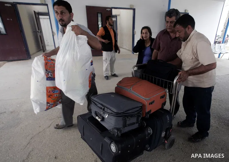 Palestinians arrive at their side of the Rafah border crossing with Egypt in the southern Gaza Strip on May 8, 2011. photo by Abed Rahim Khatib