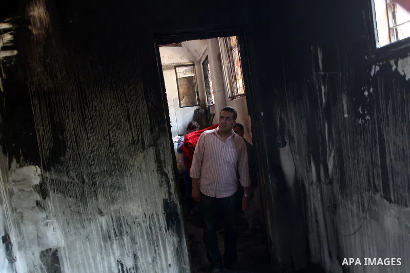 Egyptians Christians remove objects from the damaged Virgin Mary church in the popular area of Imbaba in the Egyptian capital of Cairo on May 8, 2011, after overnight clashes between Muslims and Christians which left 10...