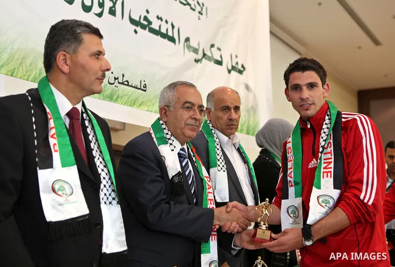 Palestinian Prime Minister, Salam Fayyad honors the members of the Olympic National team in the West Bank city of Ramallah on May 8, 2011. Photo by Mustafa Abu Dayeh