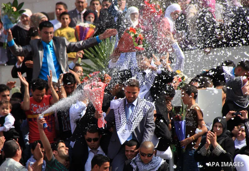 Palestinian students from the Fatah movement take part in a rally during their graduation ceremony at A-Najah University in the West Bank city of Nablus, Sunday, May 8, 2011. Photo by Wagdi Eshtayah