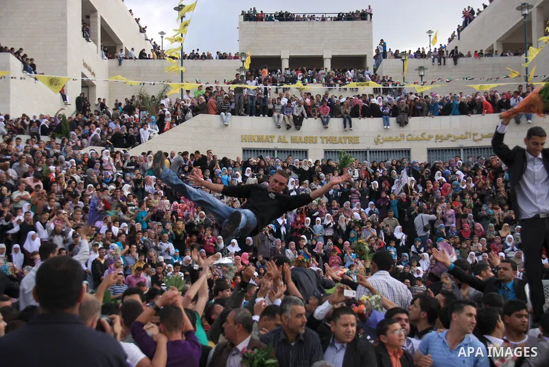 Palestinian students from the Fatah movement take part in a rally during their graduation ceremony at A-Najah University in the West Bank city of Nablus, Sunday, May 8, 2011. Photo by Wagdi Eshtayah