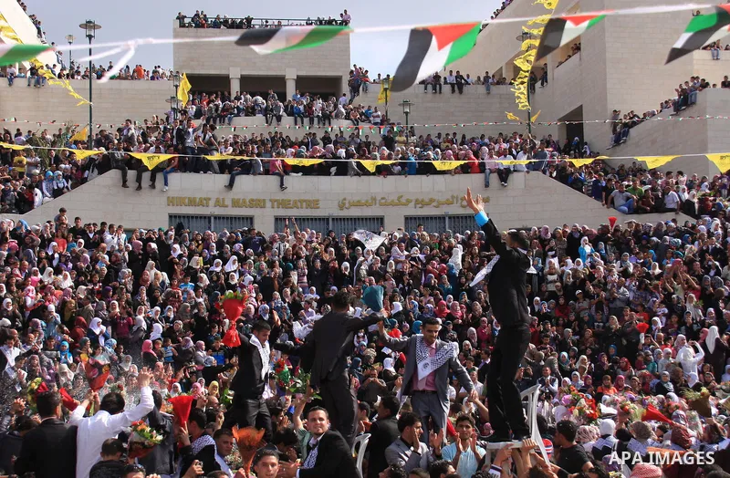 Palestinian students from the Fatah movement take part in a rally during their graduation ceremony at A-Najah University in the West Bank city of Nablus, Sunday, May 8, 2011. Photo by Wagdi Eshtayah