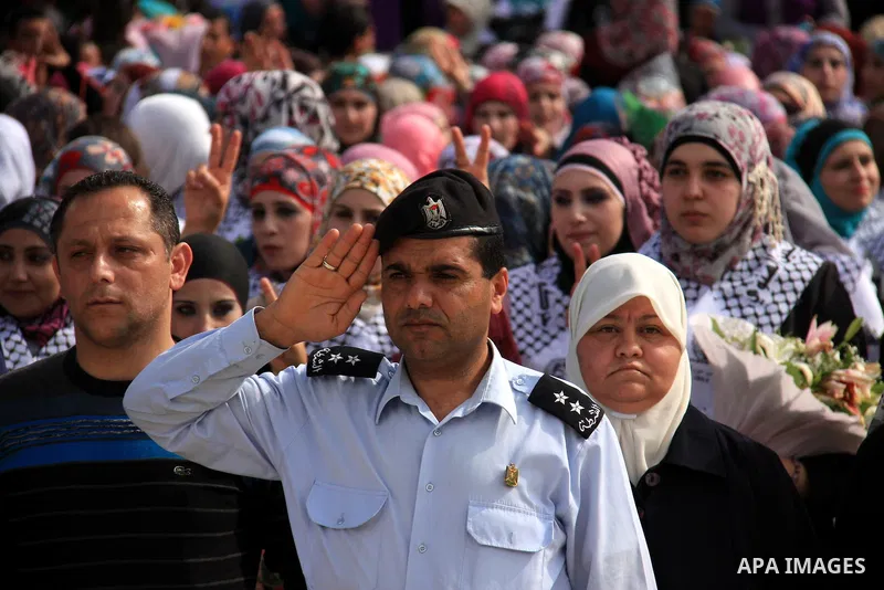 Palestinian students from the Fatah movement take part in a rally during their graduation ceremony at A-Najah University in the West Bank city of Nablus, Sunday, May 8, 2011. Photo by Wagdi Eshtayah