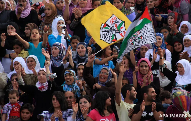 Palestinian students from the Fatah movement take part in a rally during their graduation ceremony at A-Najah University in the West Bank city of Nablus, Sunday, May 8, 2011. Photo by Wagdi Eshtayah