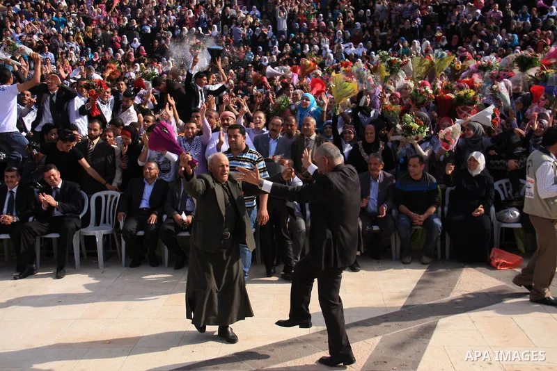 Palestinian students from the Fatah movement take part in a rally during their graduation ceremony at A-Najah University in the West Bank city of Nablus, Sunday, May 8, 2011. Photo by Wagdi Eshtayah