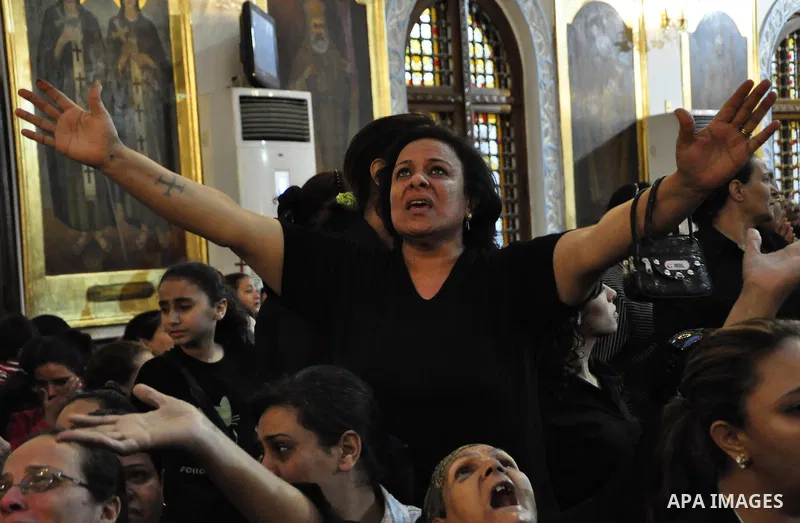 Christian woman mourns during the funeral of a victim of sectarian clashes in Cairo on May 8, 2011 as Egypt's military rulers warned they will use an "iron hand" to protect national security after clashes between Muslims...