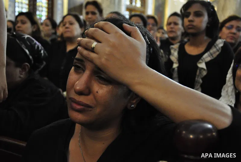 Christian woman mourns during the funeral of a victim of sectarian clashes in Cairo on May 8, 2011 as Egypt's military rulers warned they will use an "iron hand" to protect national security after clashes between Muslims...
