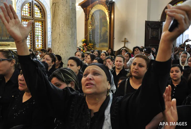 Christian woman mourns during the funeral of a victim of sectarian clashes in Cairo on May 8, 2011 as Egypt's military rulers warned they will use an "iron hand" to protect national security after clashes between Muslims...