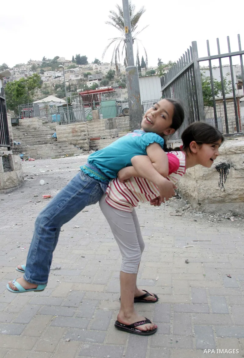 Palestinians children play in the street in the East Jerusalem neighborhood of Silwan, on May 08, 2011. Photo by Mahfouz Abu Turk