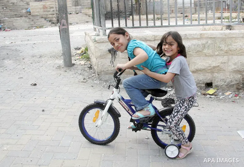 Palestinians children play in the street in the East Jerusalem neighborhood of Silwan, on May 08, 2011. Photo by Mahfouz Abu Turk