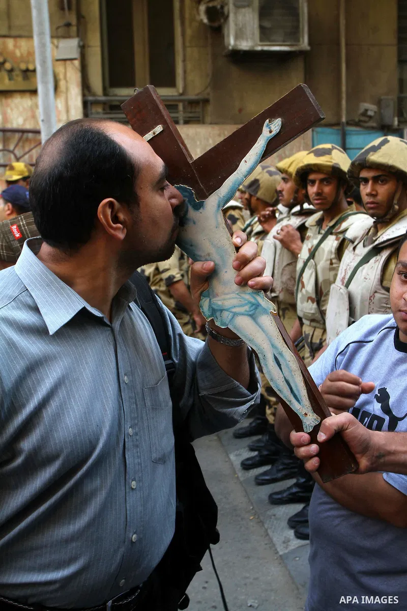 Egyptian soldiers stand guard as Coptic Christians take part in a protest in front of the U.S. embassy in Cairo on May 9, 2011, after clashes between Muslims and Christians in the Egyptian capital killed 12 people and in...