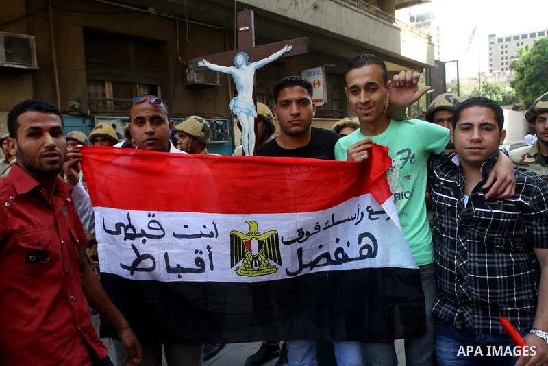 Egyptian Coptic Christians take part in a protest in front of the U.S. embassy in Cairo on May 9, 2011, after clashes between Muslims and Christians in the Egyptian capital killed 12 people and injured scores on May 8,20...