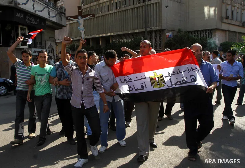 Egyptian Coptic Christians take part in a protest in front of the U.S. embassy in Cairo on May 9, 2011, after clashes between Muslims and Christians in the Egyptian capital killed 12 people and injured scores on May 8,20...