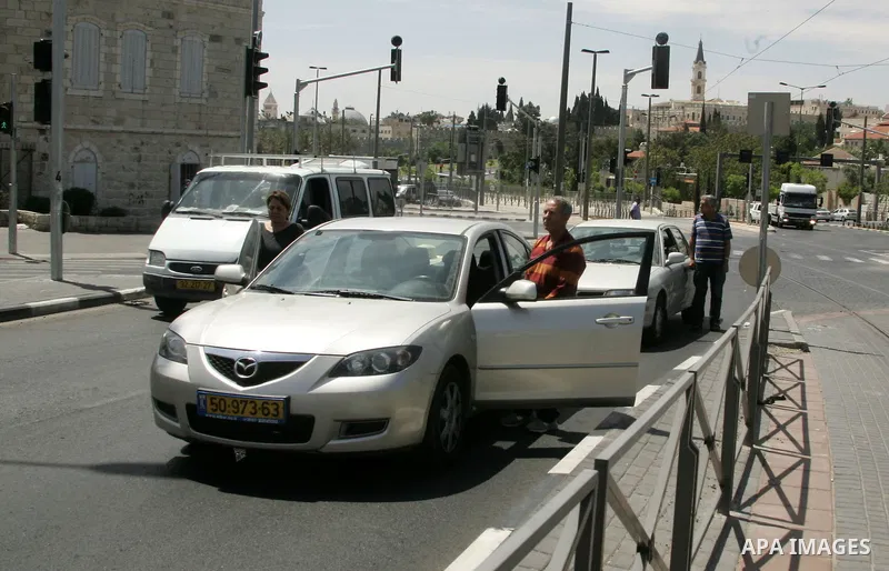 Israelis observe two minutes of silence as a siren wails across the country marking Remembrance Day for the fallen soldiers, in east Jerusalem, on May 9, 2011. Remembrance Day is followed immediately by the 63rd annivers...