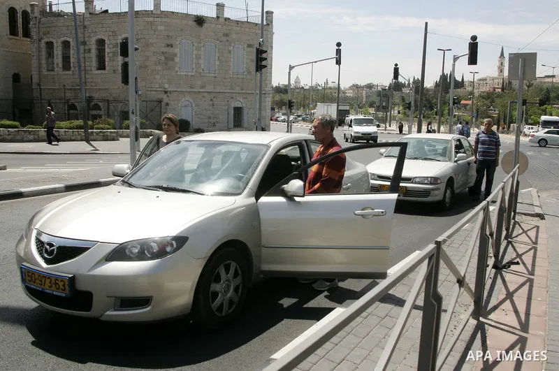 Israelis observe two minutes of silence as a siren wails across the country marking Remembrance Day for the fallen soldiers, in east Jerusalem, on May 9, 2011. Remembrance Day is followed immediately by the 63rd annivers...