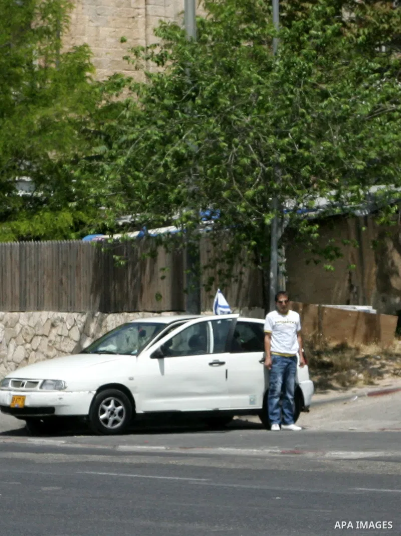 Israelis observe two minutes of silence as a siren wails across the country marking Remembrance Day for the fallen soldiers, in east Jerusalem, on May 9, 2011. Remembrance Day is followed immediately by the 63rd annivers...