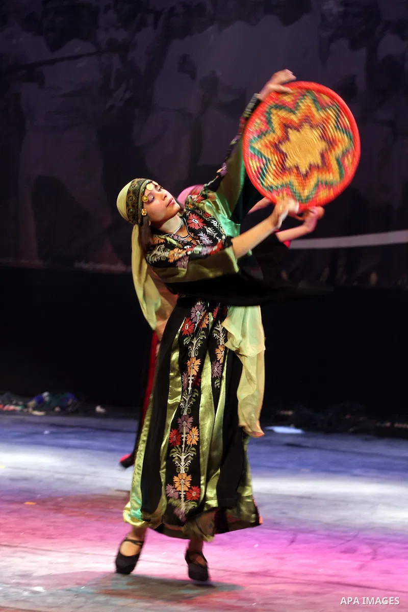 Palestinians, from Lebanon refugee camps, perform traditional dancing Dabka during a celebration at the Cultural Palace in the West Bank city of Ramallah on May 8,2011. Photo by Issam Rimawi