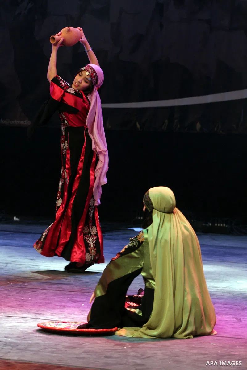 Palestinians, from Lebanon refugee camps, perform traditional dancing Dabka during a celebration at the Cultural Palace in the West Bank city of Ramallah on May 8,2011. Photo by Issam Rimawi