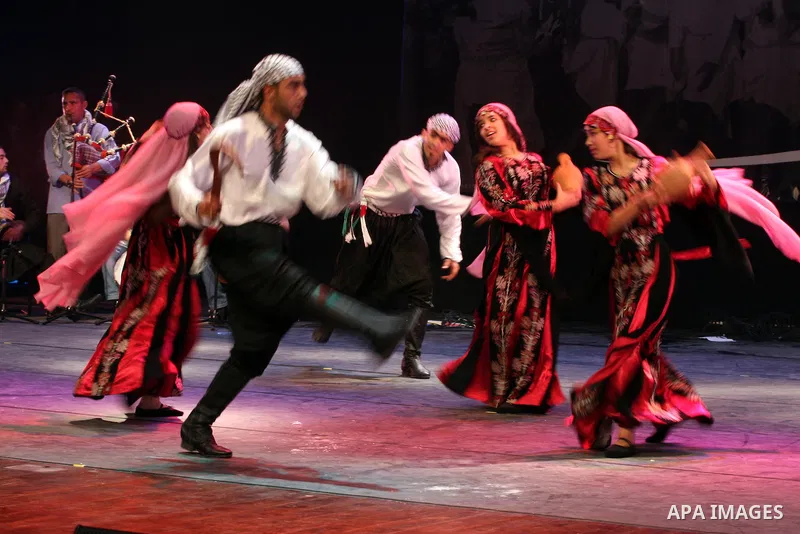 Palestinians, from Lebanon refugee camps, perform traditional dancing Dabka during a celebration at the Cultural Palace in the West Bank city of Ramallah on May 8,2011. Photo by Issam Rimawi