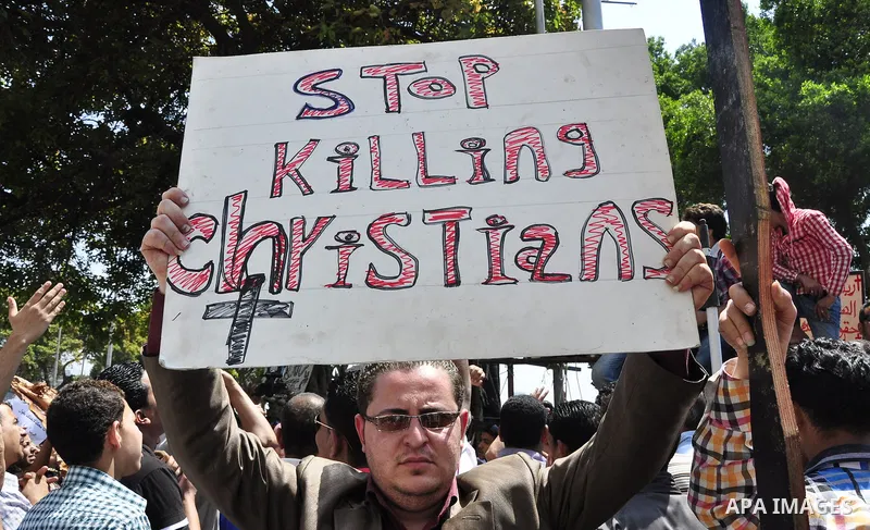 Egyptian Christians protest in front of the state television building in Cairo on May 9, 2011 against recent attempts to trigger sectarian conflict in the country, as the government has vowed to use an "iron fist" to ens...