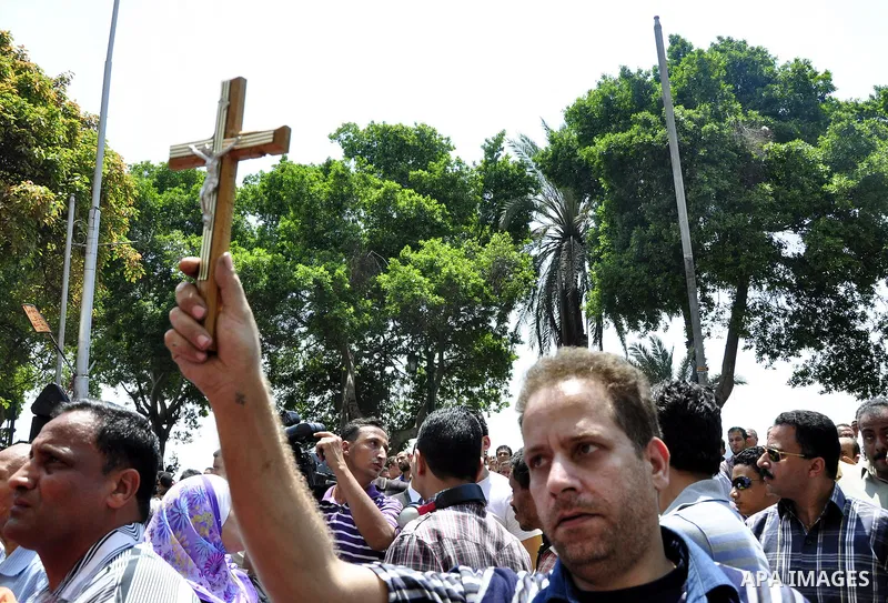 Egyptian Christians protest in front of the state television building in Cairo on May 9, 2011 against recent attempts to trigger sectarian conflict in the country, as the government has vowed to use an "iron fist" to ens...