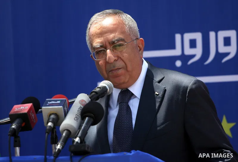 Palestinian Prime Minister, Salam Fayyad participates in a celebration to mark "Europe Day" in the West Bank city of Ramallah on May 9, 2011. France announced it would donate 10 million euros to the Palestinian Authority...
