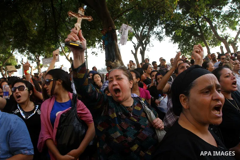 Egyptian Christians protest in front of the state television building in Cairo on May 9, 2011 against recent attempts to trigger sectarian conflict in the country, as the government has vowed to use an "iron fist" to ens...