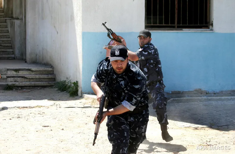Palestinian Hamas security forces show their skills during a graduation ceremony at the Arafat police compound in Gaza City on May 10, 2011. Photo by Mohammed Othman