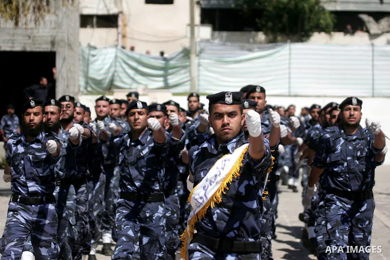 palestinian Hamas security forces march with their riot gear during a graduation ceremony at the Arafat police compound in Gaza City on May 10, 2011. Photo by Mohammed Othman