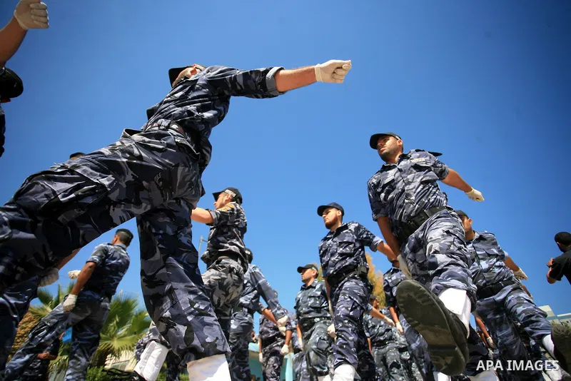 palestinian Hamas security forces march with their riot gear during a graduation ceremony at the Arafat police compound in Gaza City on May 10, 2011. Photo by Mohammed Othman